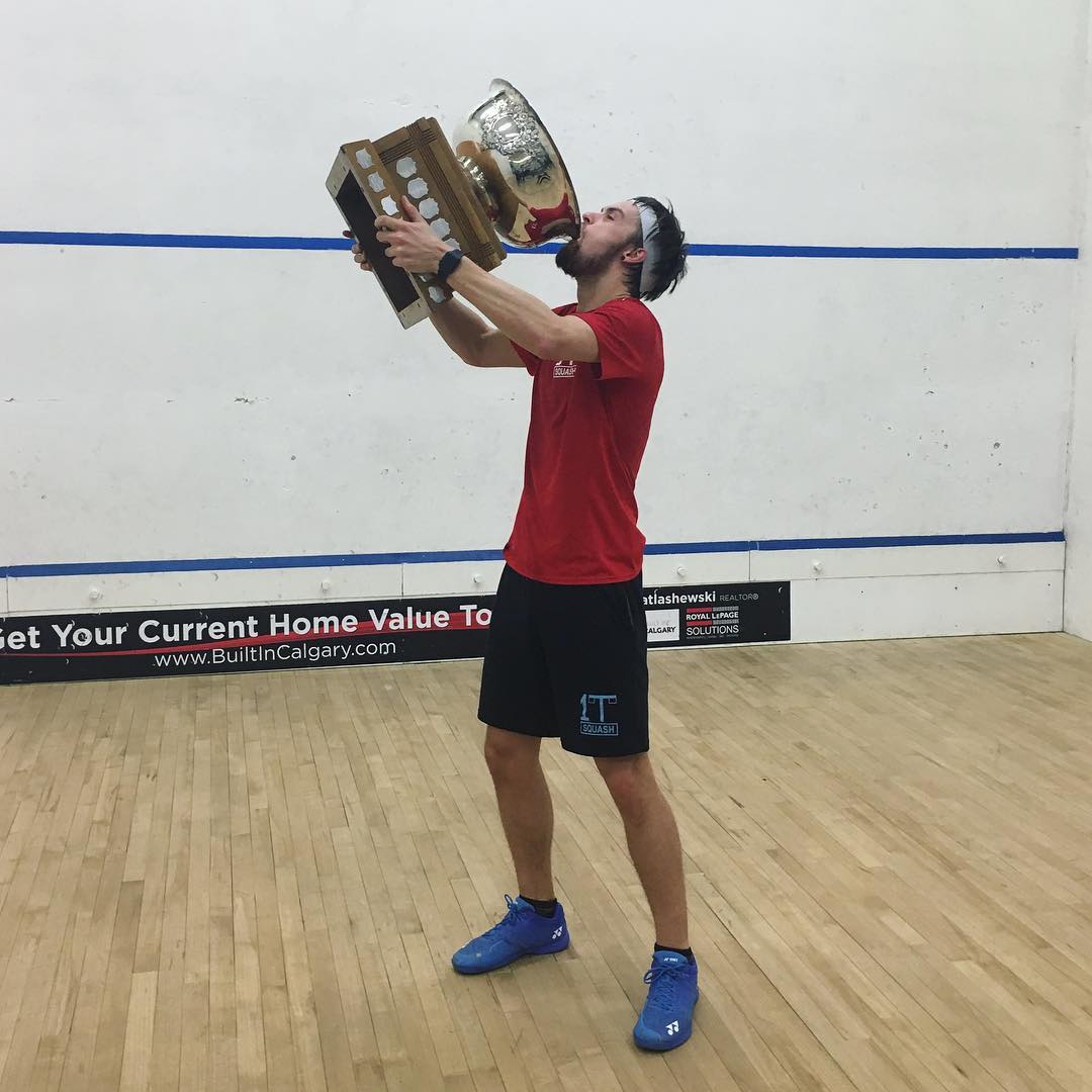 Connor Turk kissing the championship trophy